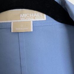 It’s A Beautiful Woman’s Shirt In Size 12 The Color Is baby blue made by Michael Kors