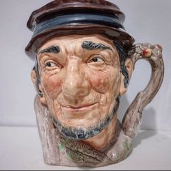 ROYAL DOULTON 1952 JOHNNY APPLESEED TOBY MUG 
ROYAL DOULTON LARGE CERAMIC 1952 TOBY MUG JOHNNY APPLESEED
MEASURES 6 INCHES TALL 
NO CRACKS CHIPS OR RE