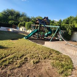 Cedar Cove Outdoor Playground Set w/ Tube Slide, Wave Slide, Elevated Clubhouse, Shaded Playhouse, and Swing Set