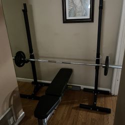 Stand rack & barbell 7ft and two cap plates 25 pounds each like new