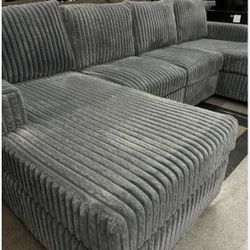 Brand new grey fur like corduroy Sectional Sofa with double chaise and two accent pillows. 