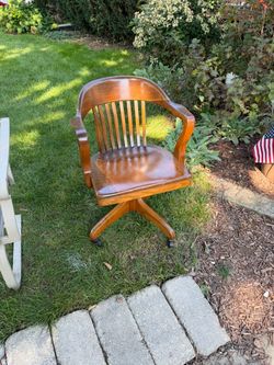 Antique Wooden Bankers Desk Chair Solid Oak, on wheels, swivels, $45
