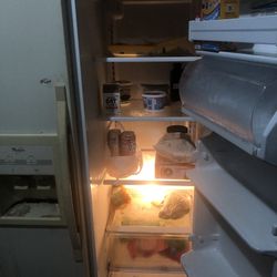 Older, whirlpool, side-by-side, beige