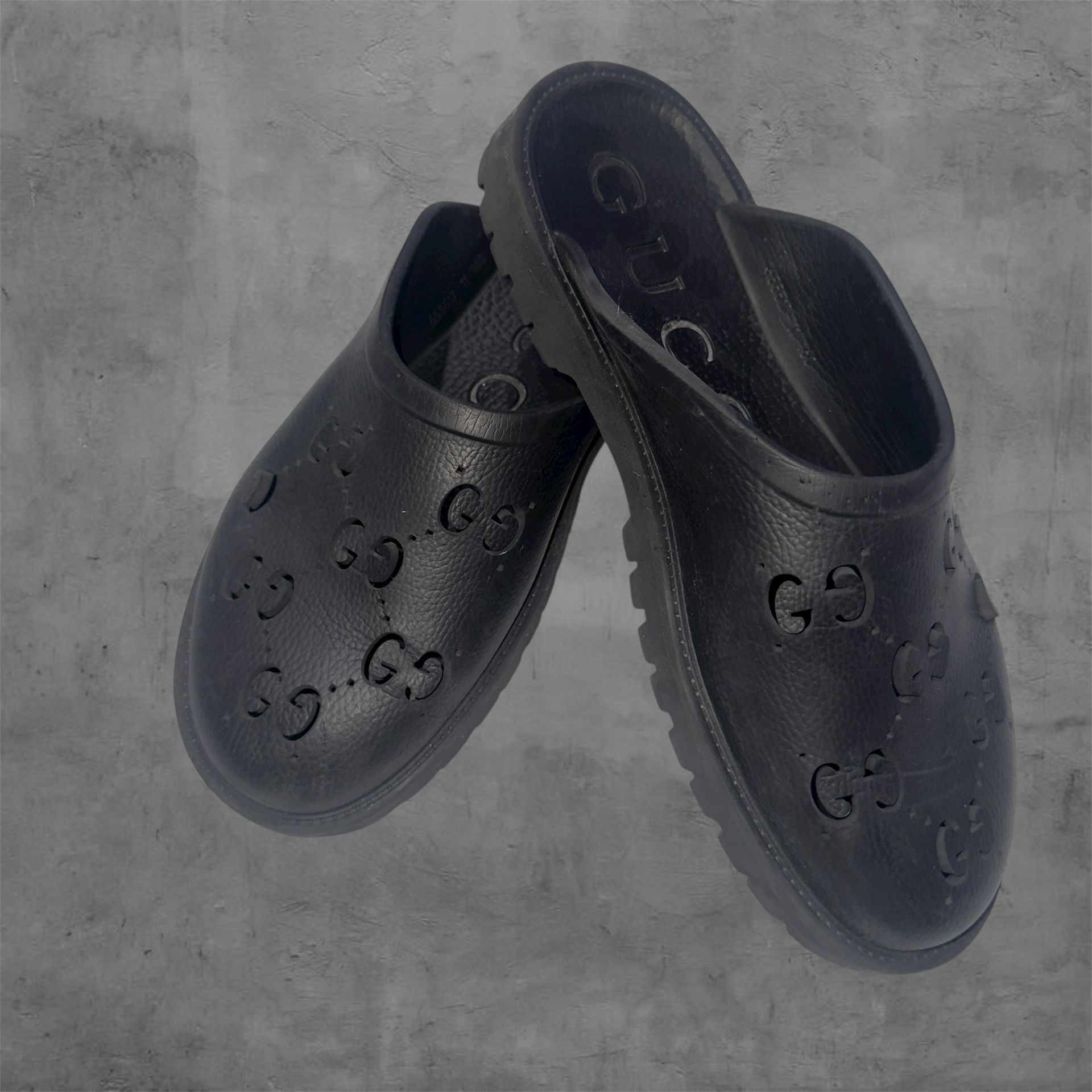 Black Gucci Rubber Mules With Signature "GG" Detail