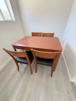 Wood Dining table with wood and leather chairs