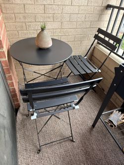 Black metal folding indoor-outdoor cafe table and chairs set for two