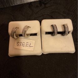 4 Pairs Of Stainless Steel Hoop Earrings..