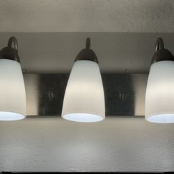 Builder grade Brushed silver chandelier And bathroom vanity light