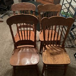 Four Oak dining chairs