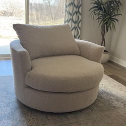 Cream colored swivel chair
