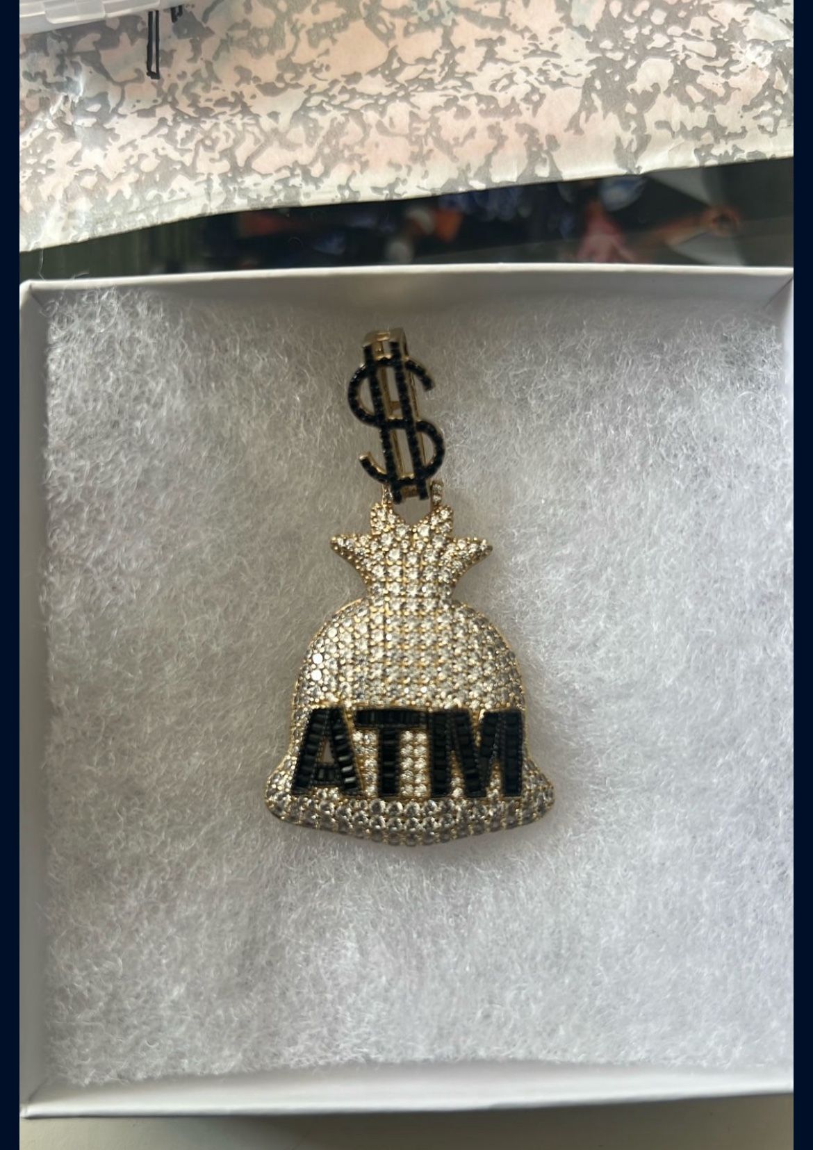 Moissanite and 18 karat gold pendant