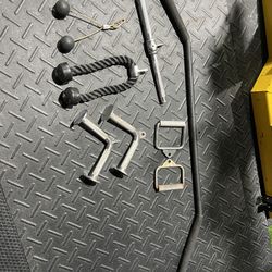  2 V - Bars  1 Rope  1 Lateral pulldown bar Small Curl Bar Etc.