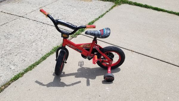 Huffy kids, boys Lightning McQueen 12 in bike for Sale in Chicago, IL - OfferUp