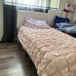 twin size bed with white headboard