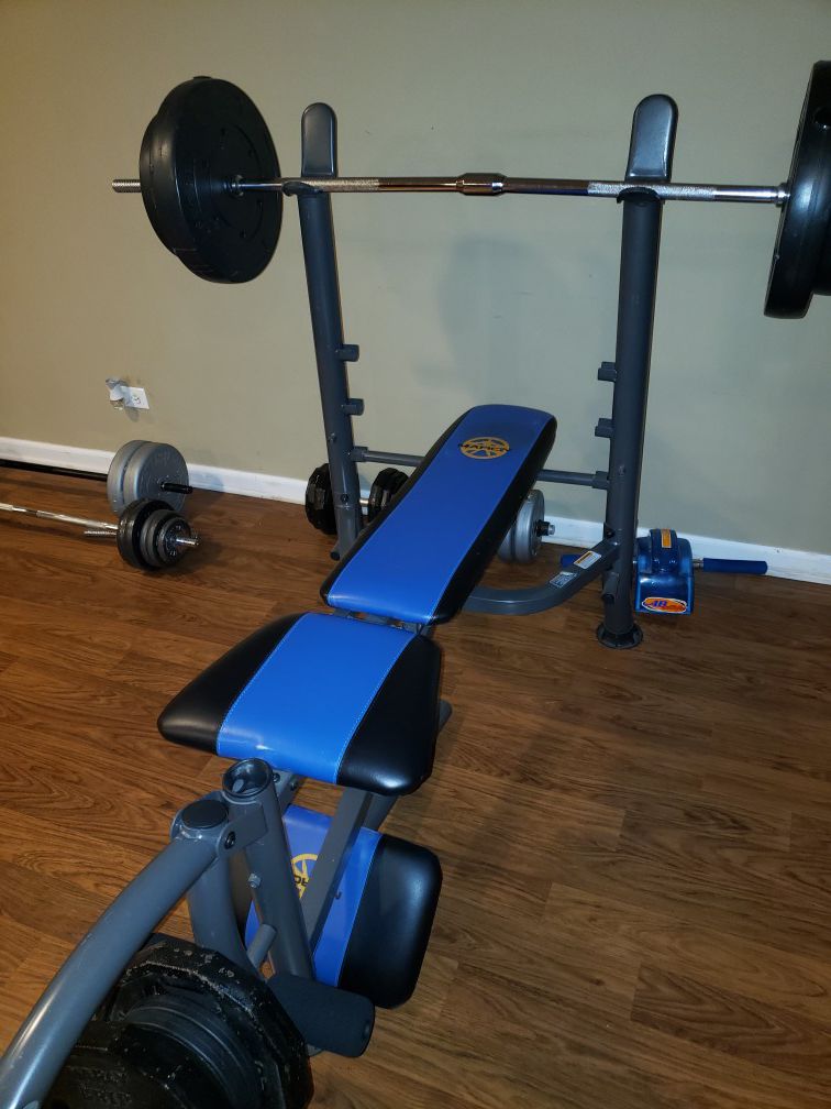 Marcy bench bar and weights.