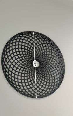 Geometric circular dark wooden hanging piece of art