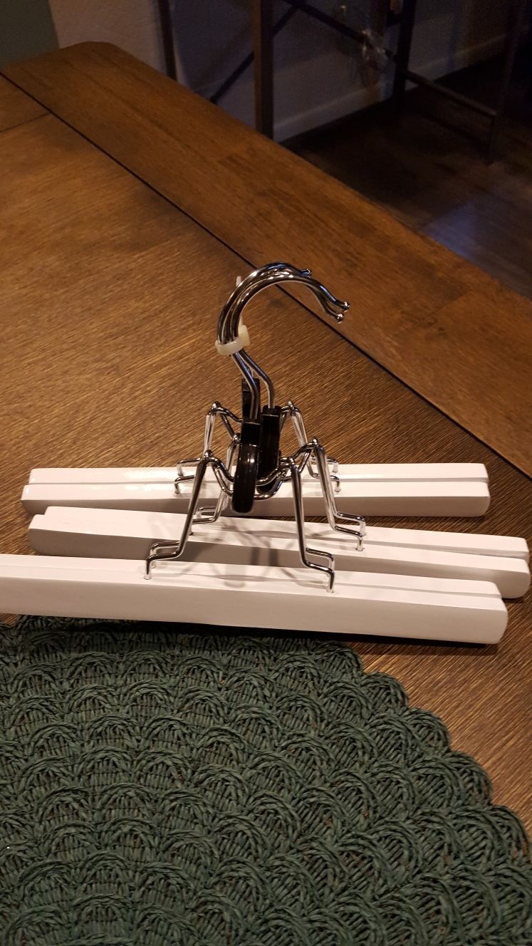 Three new wooden hangers