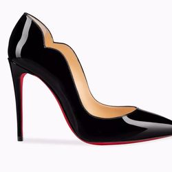 These  Christian Louboutin faux stylish high-heeled shoes feature a glossy black color, patent leather material, and a pointed-toe pump design with a 