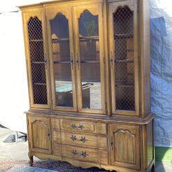 Thomasville French Provincial china cabinet in a natural wood finish
