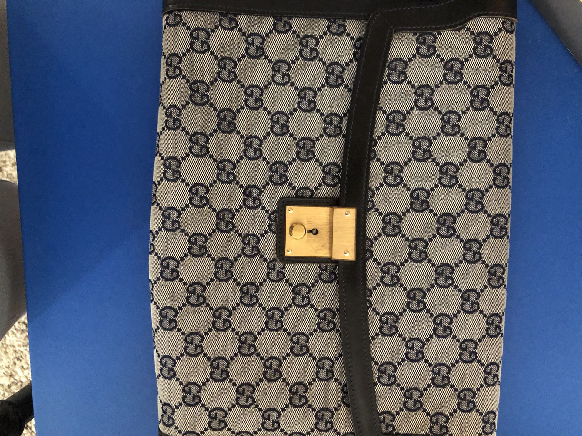 Vintage Gucci monogram clutch bag