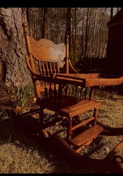Antique Tiger Oak Convertible Pressed Back High Chair, Rocking chair, and Stroller in one.