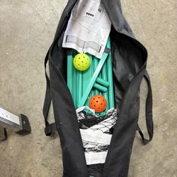 Pickle Ball Net And Two Balls