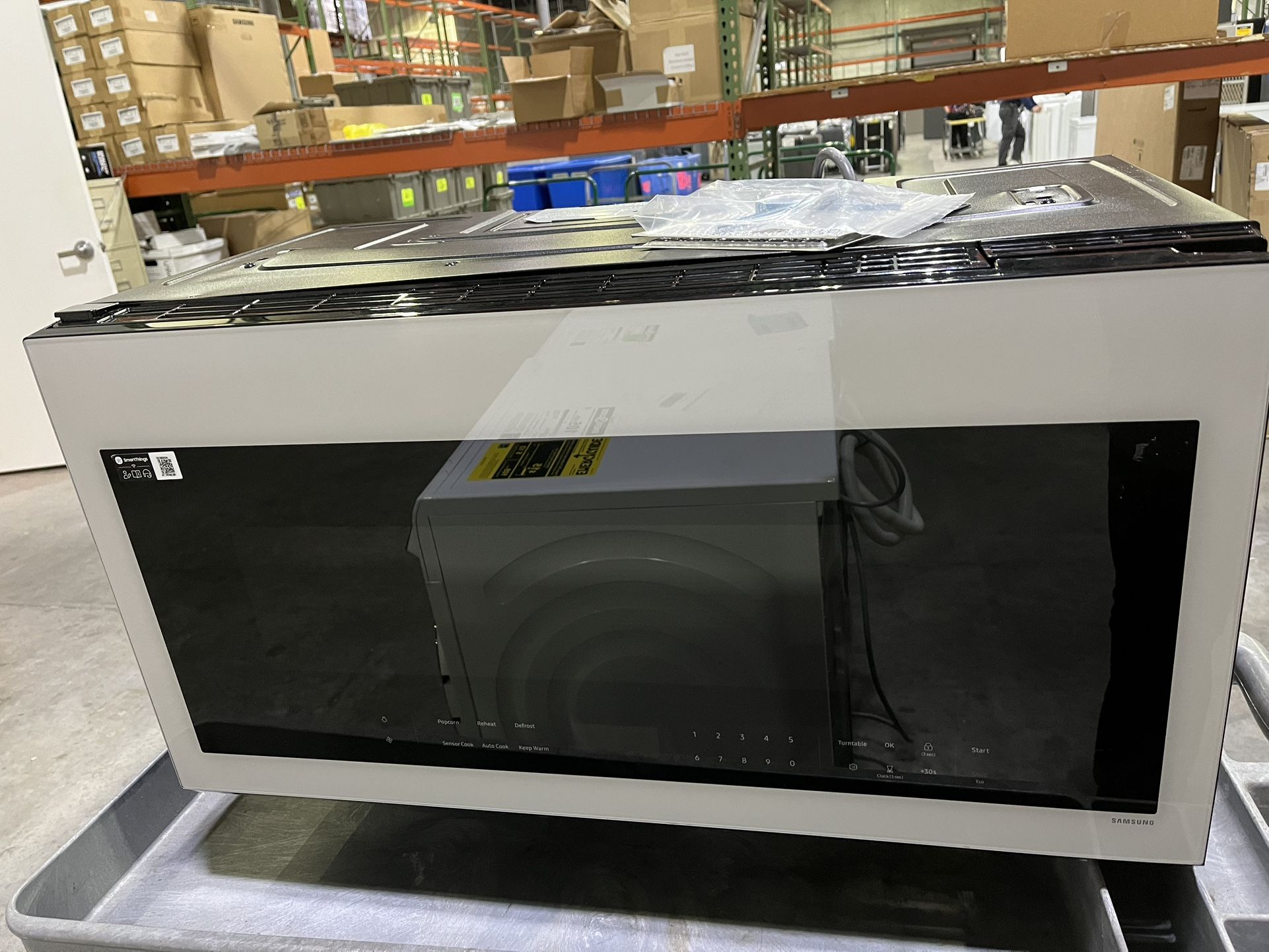 Samsung Bespoke Smart 2.1 cu. ft. Over-the-Range Microwave with Auto Connectivity & SmartThings Cooking in White Glass Model # ME21DB630012 MSRP 399