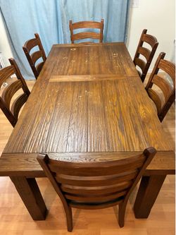 Expanding dining table and chairs