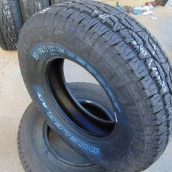 245 75 16 Bridgestone Dueler A/T Revo3 Tires  Outlined White Letters 4PLY  Date 2024