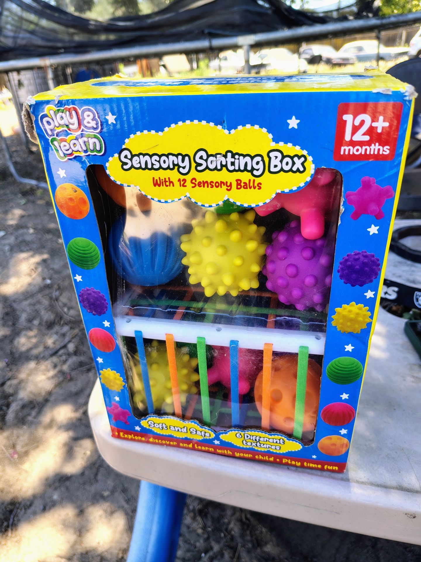 Brand new never open is the box a little bit damaged 12 plus months play and learn toys