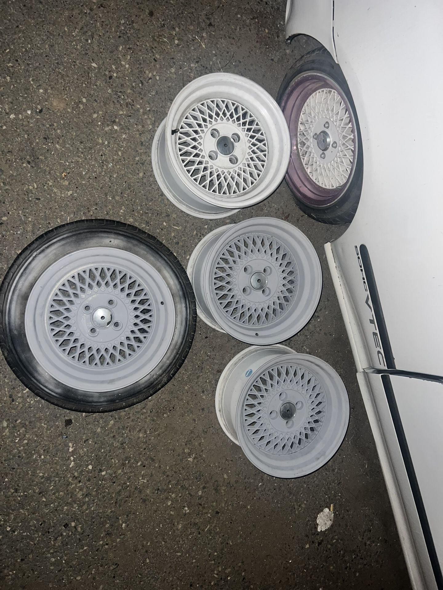 2 Sets Of Wheels An Some Car Parts