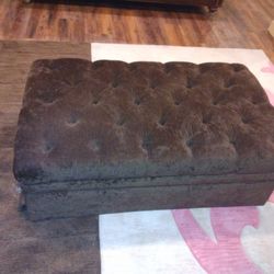 CHOCOLATE OTTOMAN (RIPS ON THE SIDE)
