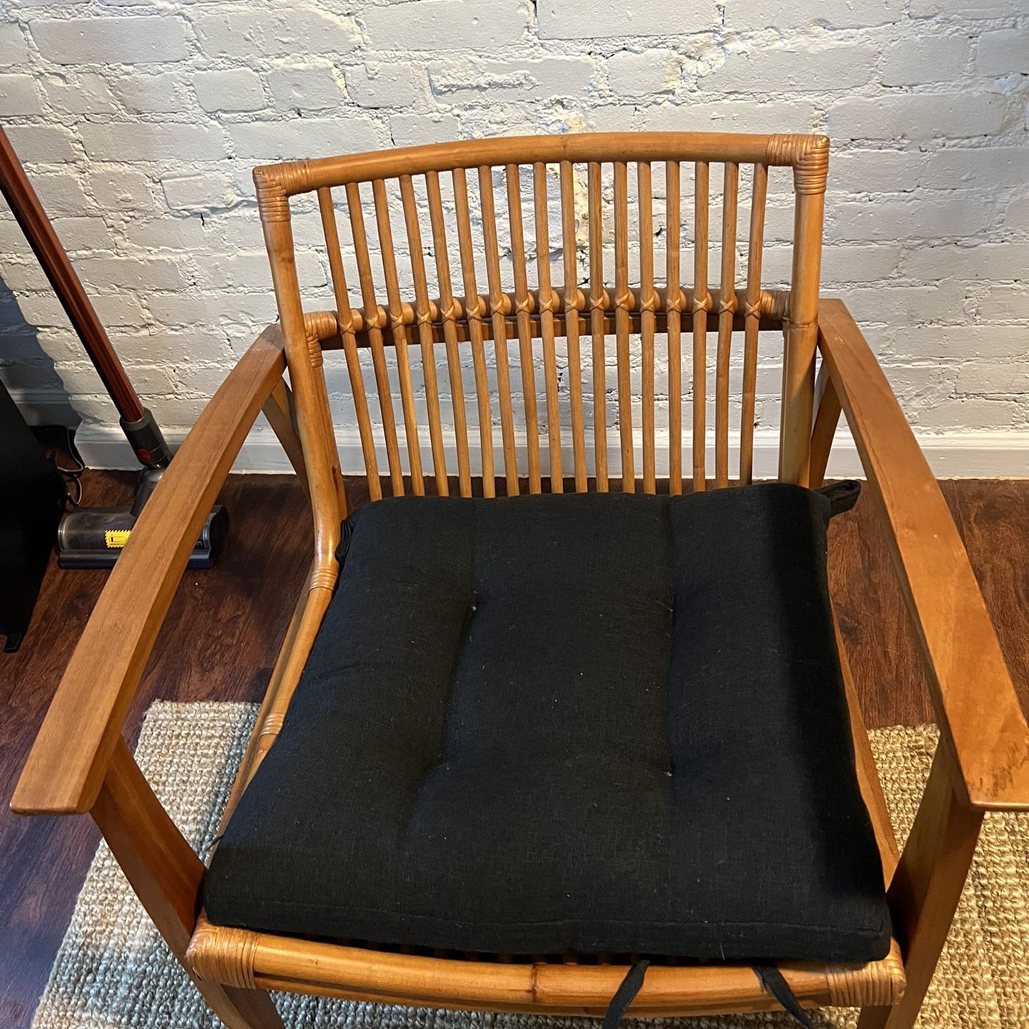 CB2 NOELIE RATTAN LOUNGE CHAIR WITH BLACK CUSHION for Sale in New