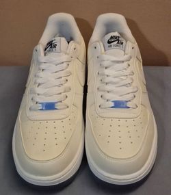 Nike Air Force 1 '07 LX UV Reactive - Wm(Sz 9.5)Fresh Nike Air Force 1 Low sneakers. White cream color with blue AF1 lace locks. Classic style. Looks 