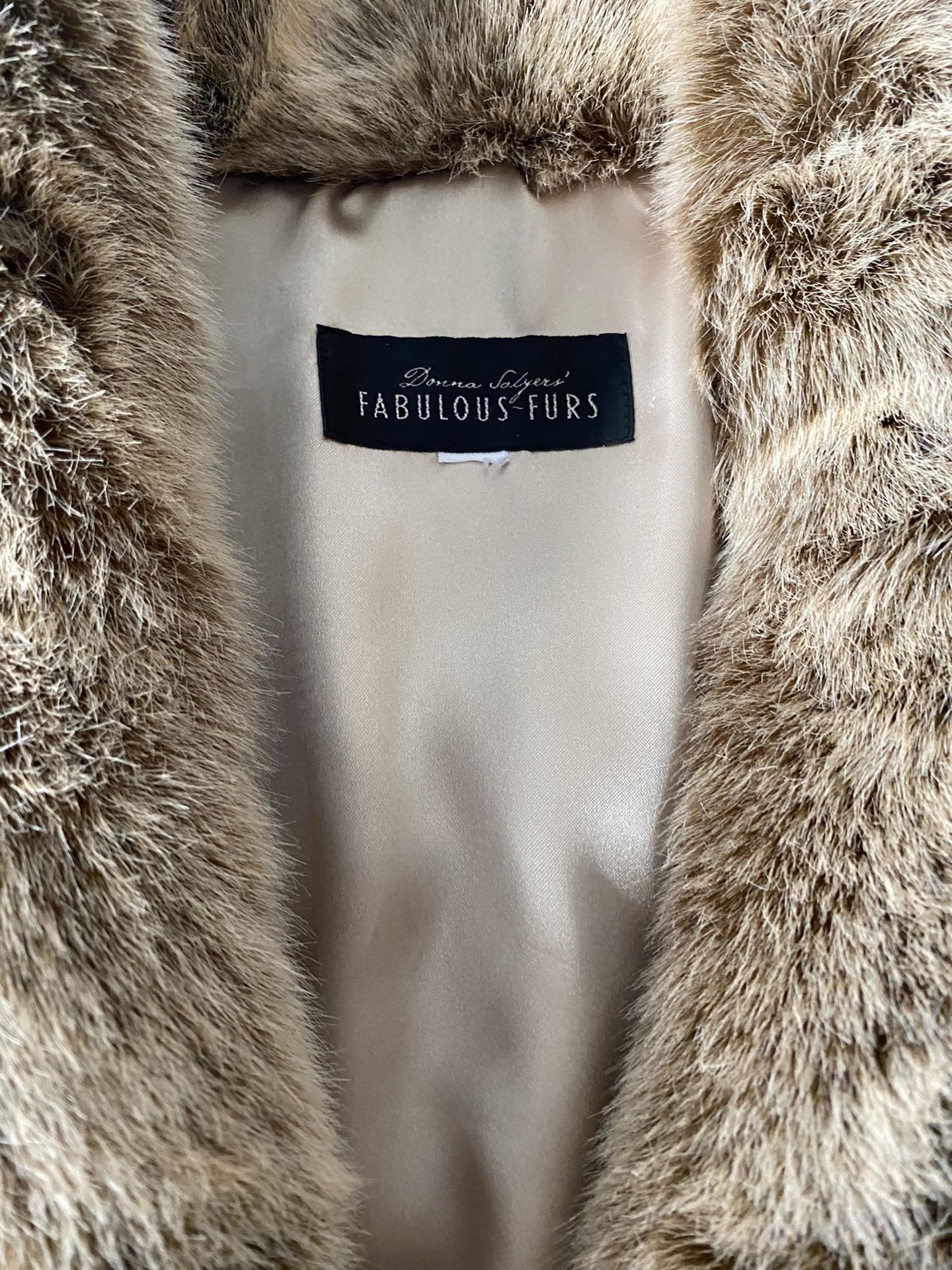 Donna Salyers (Fabulous Furs) Faux Furs Shaw Collar, 3/4 length, 16/18 sells new at $399.00. Worn only a couple times. Like new, immaculate condit