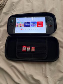 Nintendo Switch with Case and 3 Game Cartridges