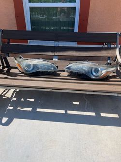 A pair of front headlights (left and right) for a 2016 Toyota Camry—used, but in good condition.