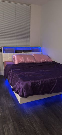Queen size floating bed with ample hidden storage and LED lights!
