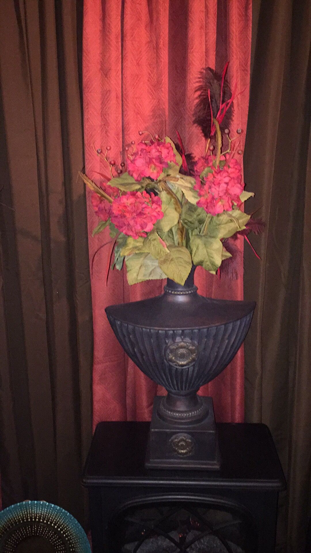 Black ceramic vase with flowers
