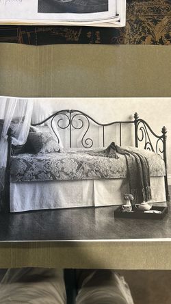 Trundle bed that turns into a full-size bed. The second mattress is under the top mattress. And it just rolls out and fits into place.
