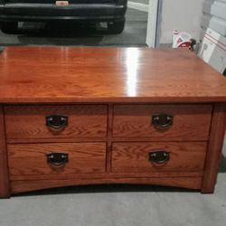 1 Coffee table w/ 8 storage drawers and 1 end table w/1 draw