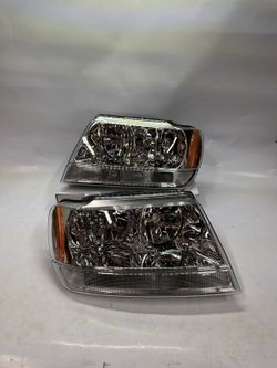 99-04 JEEP GRAND CHEROKEE CHROME HOUSING AMBER CORNER HEADLIGHTS