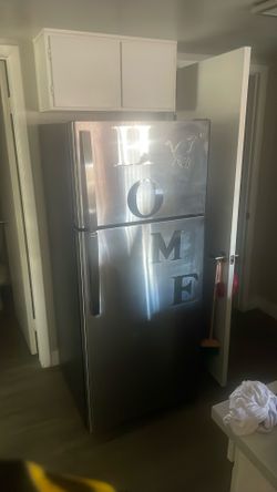 Chrome 7ft tall like new General Electric refrigerator and freezer