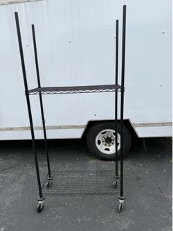 METAL STORAGE RACK ON WHEELS. 35.00 OR BEST OFFER