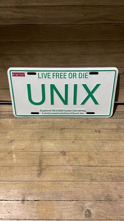 Vintage live free or die UNIX license plate cover.