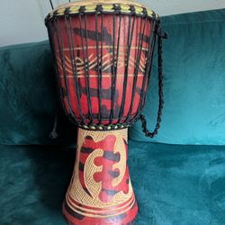 Hand Carved Djembe with authentic skin hide head 