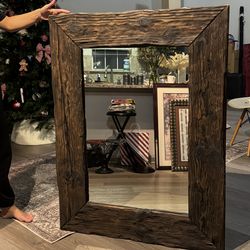 large wall mirror with a handcrafted solid wood frame. Dimensions: 48"37" Weight: around 42 lbs