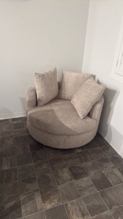 Living spaces swivel cuddler