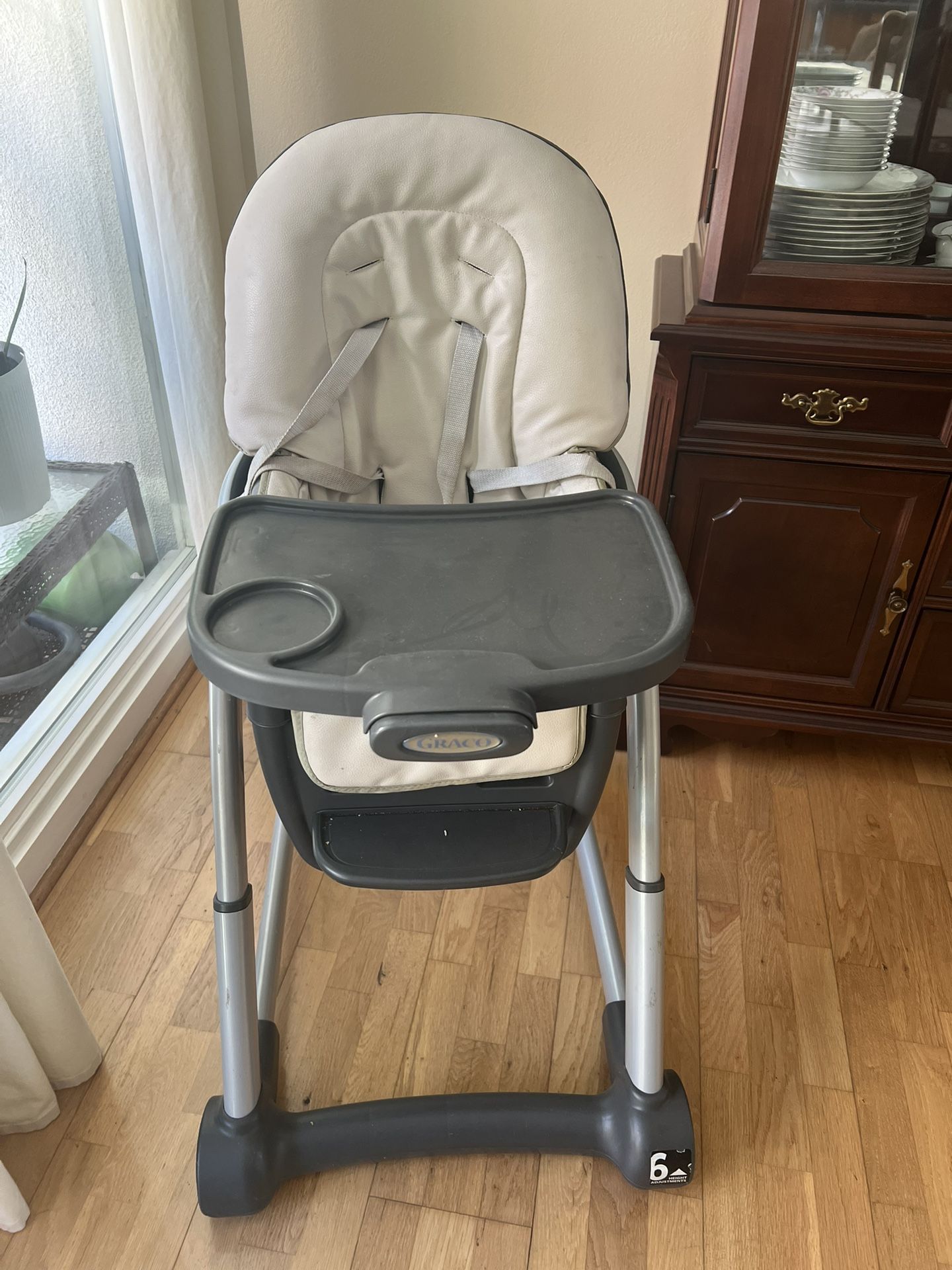High Chair For Baby And Toddler With Extra Booster Seat And Lots Of Baby Toys And Books