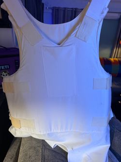 Bullet Proof ballistic vest  white, concealable ballistic vest carrier, which appears to resemble a Second Chance concealable armor carrier designed t